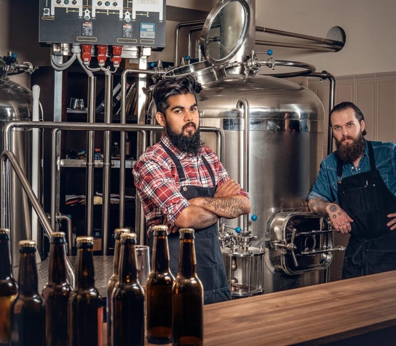 two-men-brewing-beer-in-the-craft-microbrewery-QJ87R7W.jpg